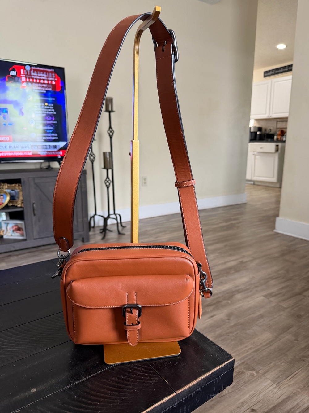 Coach Warner crossbody bag in Saddle Brown leather with gunmetal hardware